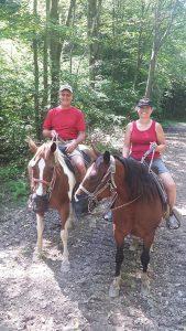 Vic and Jane riding horses