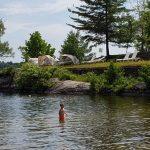 Wading in the shallow water of Lake Rosseau