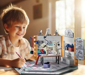 Creative child with kid drawing a house made of white paper shee