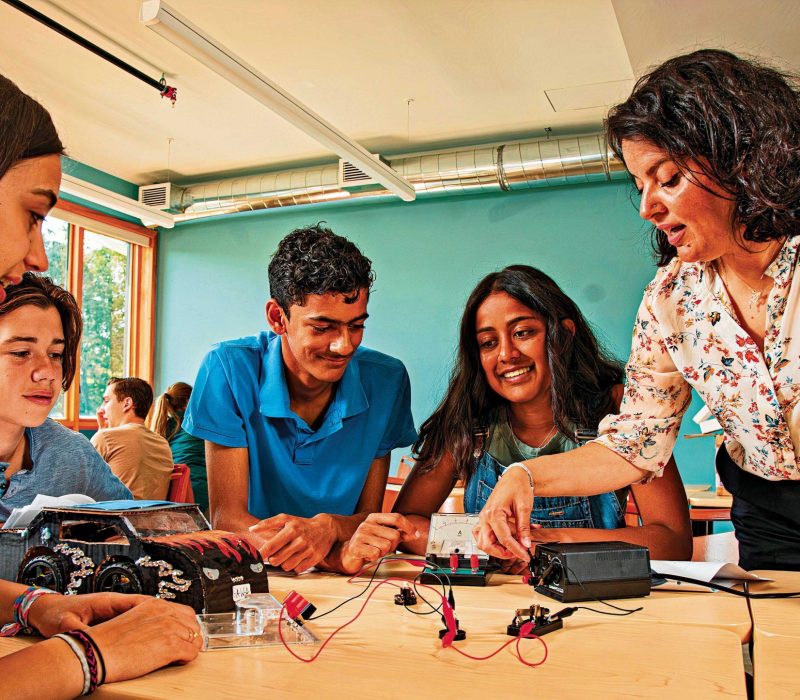 teacher with students learning about electricity