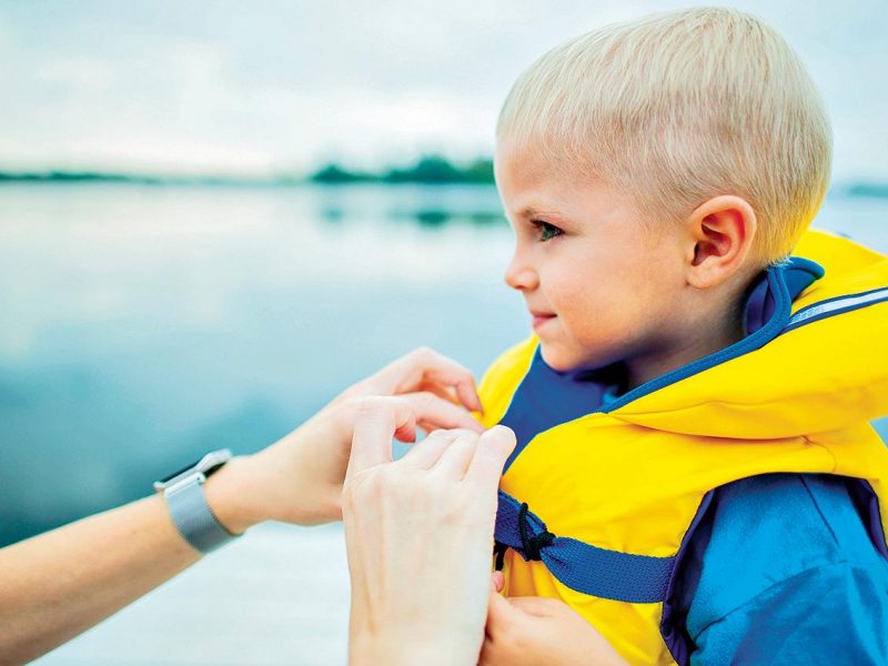 little boy with a floating vest