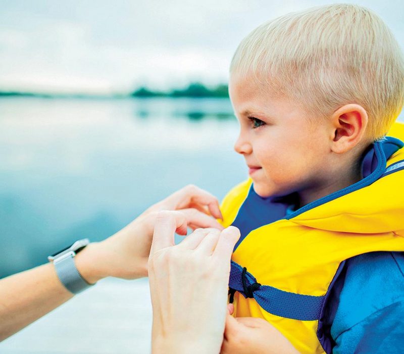 little boy with a floating vest