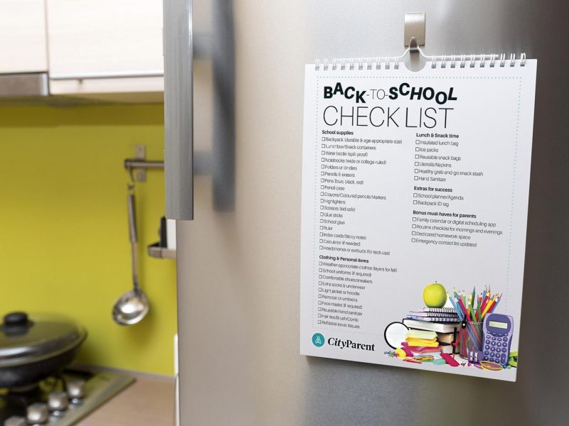 back to checklist hanging on fridge door
