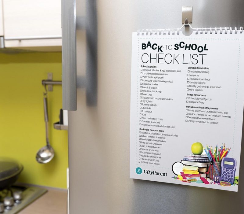 back to checklist hanging on fridge door