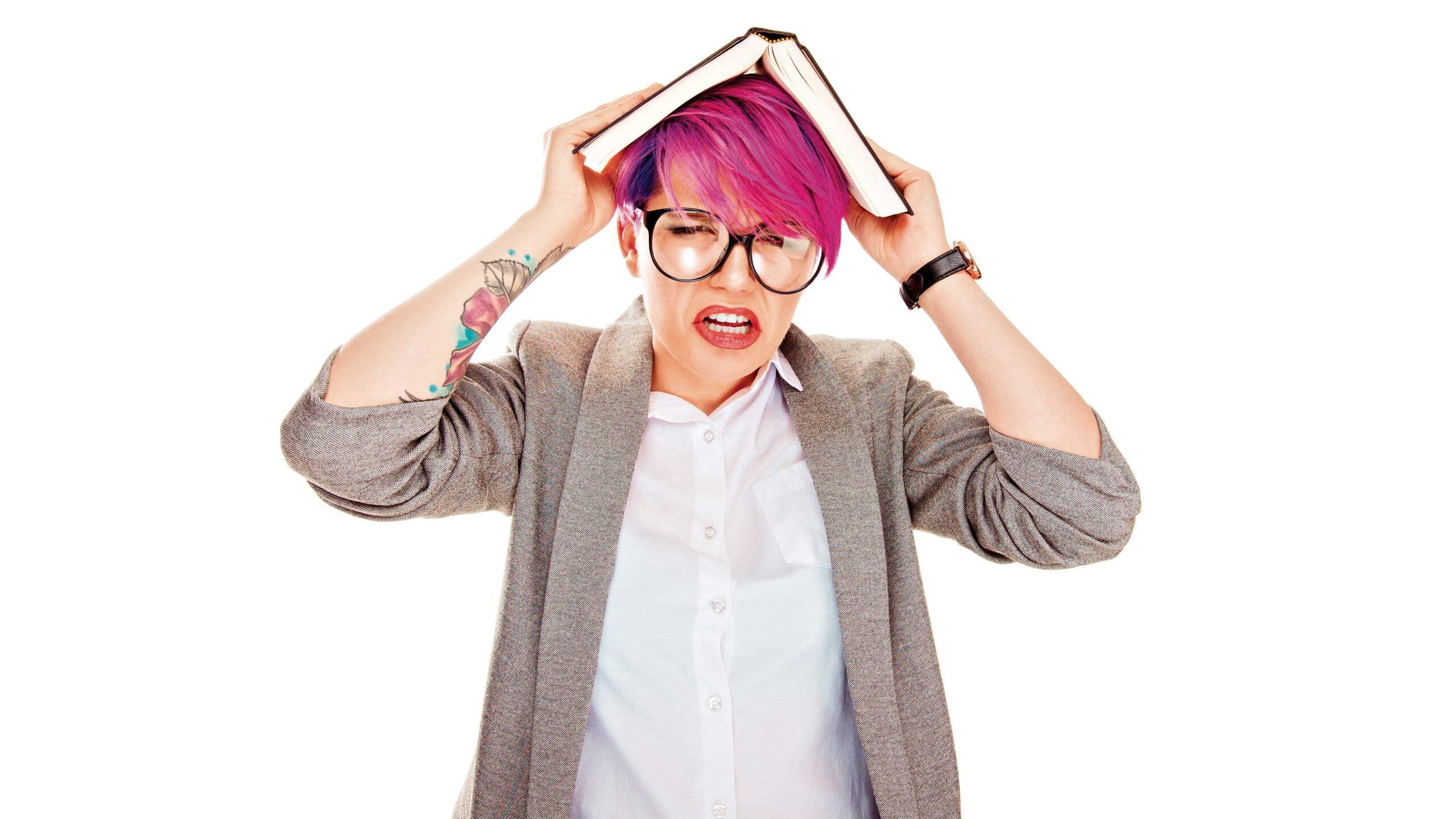 girl looking worried with book on top of her head